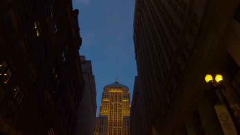 pov-fvp-driving-city-streets-Chicago-board-of-trade-building-at-night-4k