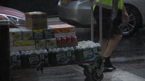 Man-delivering-sodas-in-the-rain-on-the-street-of-New-York-City---180-fps-slow-motion