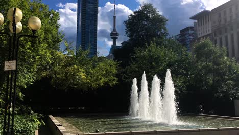 Fountain-downtown-Toronto-with-four-jets,-on-a-beautiful-summer-day