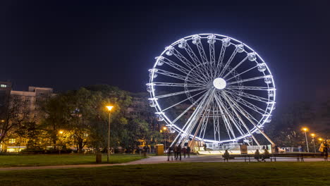 Huge-Christmas-illuminated-wheel-for-people-with-a-beautiful-view-of-Moravian-Square-in-Brno-moving-during-a-cold-evening-during-the-time-lapse-video-dominates-the-Christmas-preparations-in-city