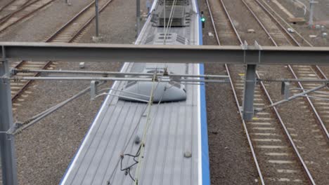 melbourne-PTv-train-passing-under-bridge,-near-Federation-Square,-Melbourne-CBD-,July-2019