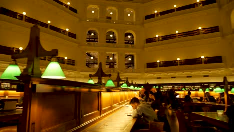 State-Library-Victoria-at-nighttime-people-studying-at-melbourne-library-Melbourne-tourism-attractions,-melbourne-library