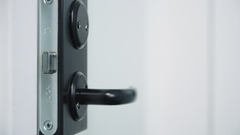 Extreme-close-up-of-black-door-handle