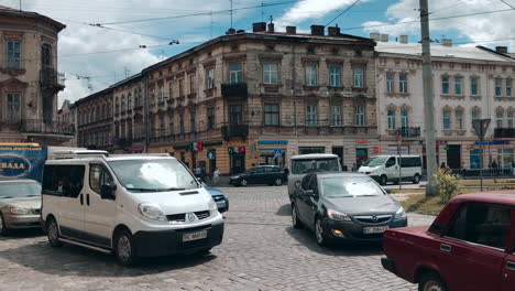 Slowmotion:-High-traffic-at-the-intersection-in-Lviv,-mess-and-chaos-on-the-road,-various-cars-and-public-transport-in-the-middle-of-the-intersection