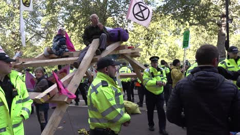 Protesters-block-the-roads-near-Westminster-during-the-Extinction-Rebellion-protests-in-London,-UK