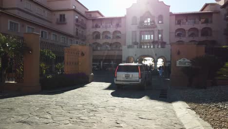SUV-pulls-into-Sheraton-Hotel-in-Cabo-San-Lucas,-Mexico