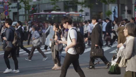 Slow-Motion-Of-People-Walking-Across-of-Famous-Shibuya-Crossing-Street-In-Tokyo,-Japan---Slow-Motion-Shot