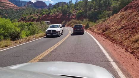 Road-trip-through-Sedona-Arizona-mountain-road-with-cars-and-rv-travelling-on-the-highway
