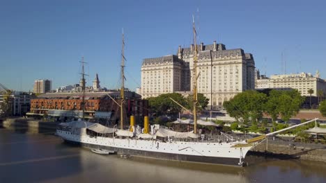 Aerial-of-ARA-Presidente-Sarmiento-museum-ship-and-Libertador-building-on-background