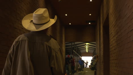 A-Mexican-groom-walks-through-the-extensive-stables-at-a-horse-show