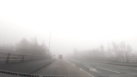 Hyperlapse-POV-dashboard-driving-in-British-fog-weather-urban-road-traffic