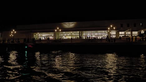 Night-view-of-Venezia-Santa-Lucia-railway-station-facade-from-the-Grand-Canal-boat-ride