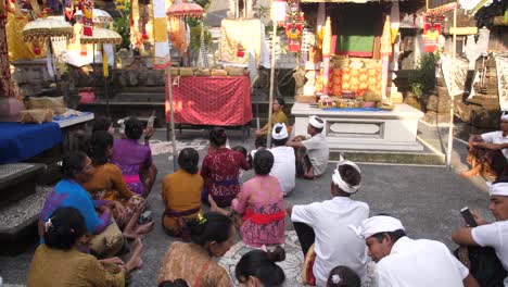 People-attend-a-ceremony-at-a-Hindu-temple-in-Bali,-Indonesia