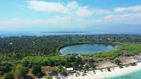 Calm-clear-water-of-natural-reservoir-inside-tropical-island-with-trees-forest,-surrounded-by-tranquil-turquoise-sea-lagoon-in-Gili-Meno,-Indonesia