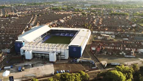 Iconic-Goodison-Park-EFC-football-ground-stadium-aerial-view,-Everton,-Liverpool-rising-tilt-down-shot