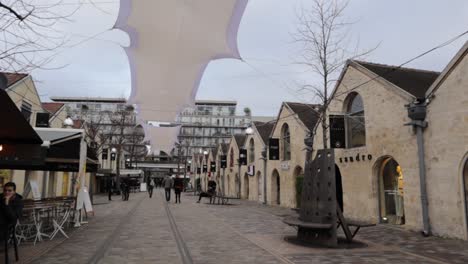 Bercy-village-dolly-out-shot-of-not-so-busy-street-during-overcast-day
