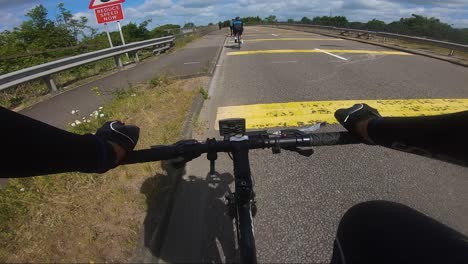 POV-Cycling-On-Edgware-Way-A41-Over-M1-Motorway,-London-Follow-Shot