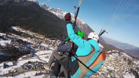 Aerial-view,-tandem-Paragliding-above-the-city-of-Madonna-DI-Campiglio-Italy