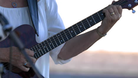 Country-musicians-plat-guitar-at-concert,-close-up-shot