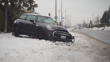 Crashed-mini-cooper-on-side-of-the-road