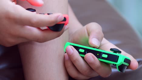 A-child's-hands---video-shot-with-macro-lens---seen-manipulating-on-Nintendo's-Switch-controller-or-joy-con