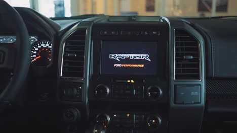 Dash-Screen-in-a-Ford-F150-Raptor-Truck-Lighting-up-with-Raptor-Logo