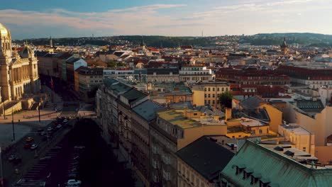 Cityscape-aerial-during-golden-hour-in-the-capital-city-Prague,-revealing-Narodni-Museum-at-wenceslas-square,-national-museum-of-Czech-Republic,-Czechia