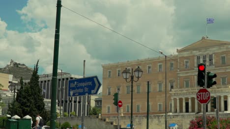 Pan-slow-motion-shot-of-Greek-Parliament,-with-cloudy-sky-in-the-background