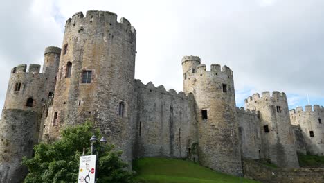Medieval-landmark-historic-Conwy-Castle-Welsh-town-scene-traffic-cityscape