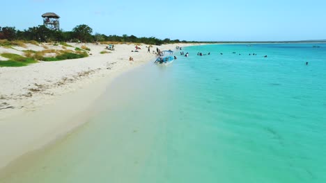 Tourists-relax-on-beach-of-Eagles-Bay