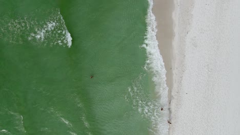 Tourist-Playing-in-Ocean-Waves-on-Tropical-Beach---Overhead-Aerial-Drone-View