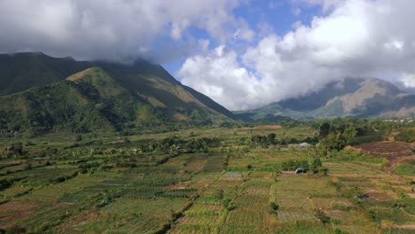 Aerial-circlng-shot-of-cloudscape-near-Mount-Pergasingan-Hill-with-beautiful-landscape-in-Lombok