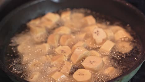 Close-up-of-banana-slices-fried-in-boiling-oil