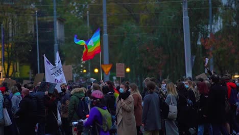 Crowd-Of-Protesters-With-Protective-Masks-On-The-Street-Of-Szczecin---Peace-Movement-Against-Total-Ban-Of-Abortion-During-Pandemic-In-Poland---medium-shot,-slow-motion