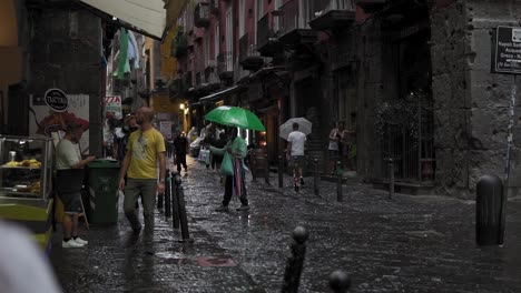 People-with-face-masks-on-rainy-streets-of-Naples,-Italy