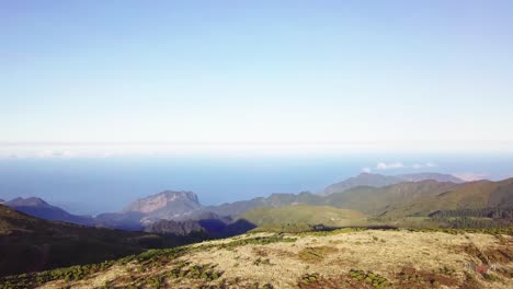 Scenic-View-From-The-Peak-Of-Pico-Do-Arieiro,-One-Of-The-Highest-Mountains-In-Madeira-Island,-Portugal---aerial-drone,-revealing-shot