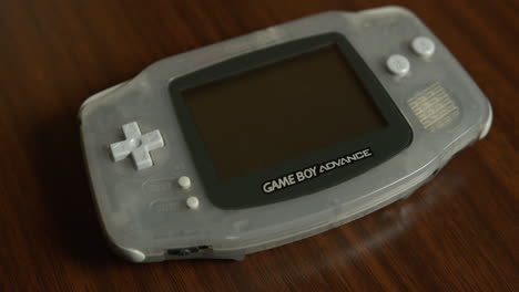 Close-Up-Pan-of-a-Game-Boy-Advance-on-a-Table