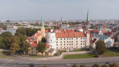 Majestic-aerial-drone-view-flying-around-Riga-Castle,-Latvia,-clear-sky-day