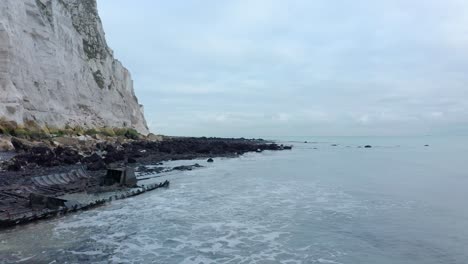 Low-aerial-shot-of-white-cliffs-of-dover-beach