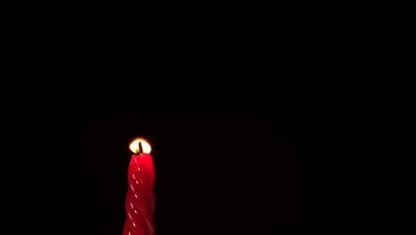 Red-candle-light-on-black-background