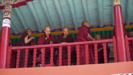 Buddhist-monk-standing-in-red-dress-at-Hemis-festival-in-the-Hemis-monastery