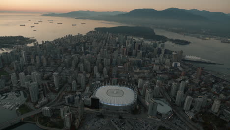 Aerial-wide-shot-of-Downtown-Vancouver-and-BC-Place,-Dusk