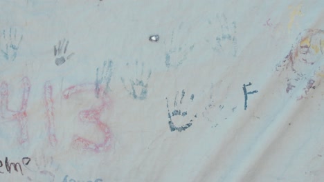 Kids-hand-prints-on-tent-at-Moria-refugee-camp