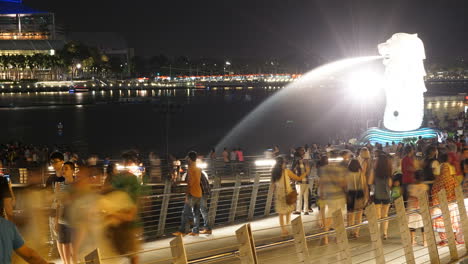 Singapore---Circa-Night-Timelapse-With-People-and-Merlion-Lion-Fountain-City-Landmark-on-Bay-Near-Central-Business-District