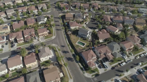 AERIAL---Low-Tilt-Up-Drone-Shot-of-Suburban-Neighborhood