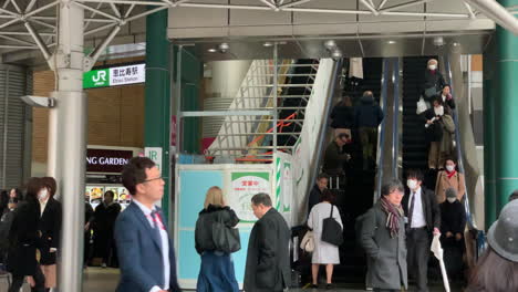 Japanese-people-climbing-and-descending-mechanical-stair-of-West-entrance-exit-of-Ebisu-Station