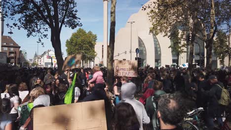 Huge-crowd-of-students,-teenagers-and-other-protesters-wait-in-the-street-in-front-of-the-Cologne-mosque,-for-a-Fridays-for-Future-protest-to-start