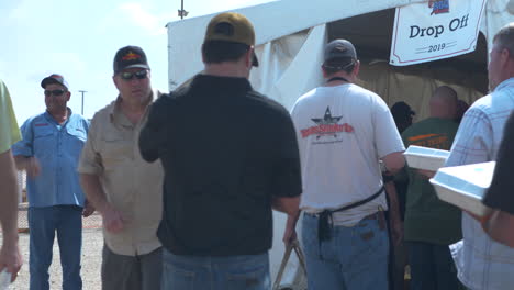 BBQ-Cooks-in-line-waiting-to-deliver-their-food-to-the-judges-at-Austin-Rodeo-BBQ-Competition