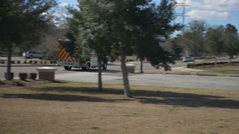 Ambulance-passes-by-on-a-street-on-its-way-to-the-scene-of-an-emergency