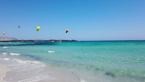 Wide-shot-of-kitesurfer-on-beautiful-beach-on-a-sunny-day